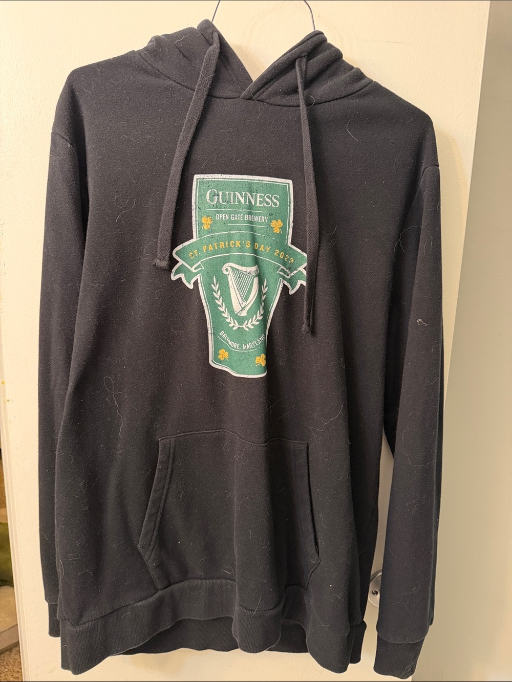 Guinness Black Hoodie with Green Crest Patch and Gold Accents